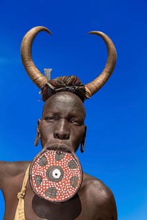 Woman with large lip plate and horns