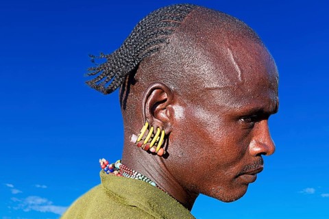 Man with earrings in ear