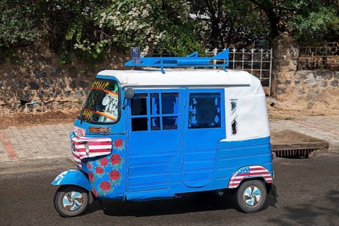 Tuk-Tuk driving on the road