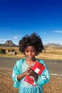 Little girl with exercise book