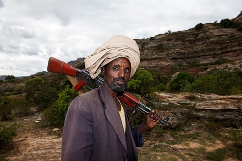 Local guide with Kalashnikov