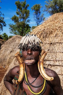 Woman with lip plate and headdress