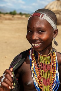 Laughing young woman with necklace