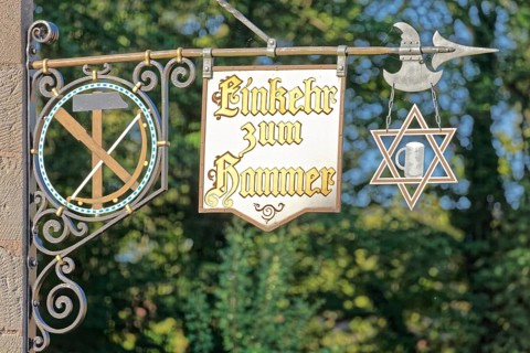 Signboards with inscription Contemplation to hammer Tavern