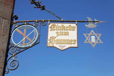 Signboards with inscription Contemplation to hammer Tavern