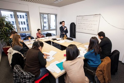 Foreigners in German lessons in an international class
