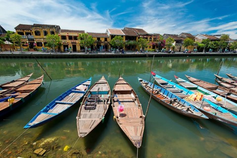 Boats at the river Thu Bon in front of historic old town