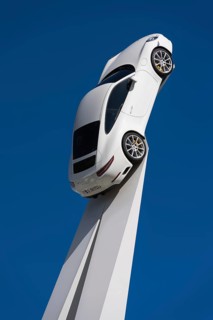 Porsche 911 Carrera 2015 on a white pedestal