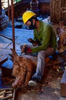 Craftsman carving a dragon figure in the Sanctuary of Truth Temple