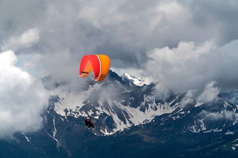 Paraglider in clouds over the Allgau Alps