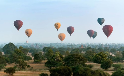 Hot-air Balloons in flight over temples