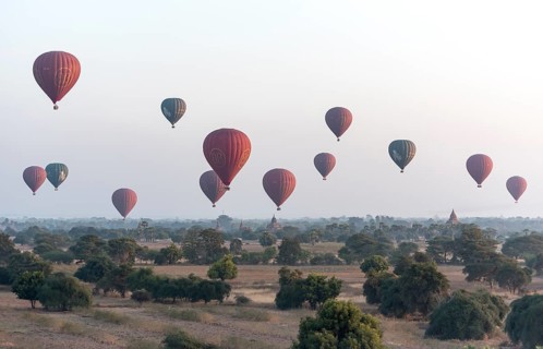 Hot-air Balloons in flight over temples
