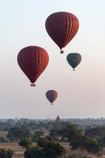 Hot-air Balloons in flight over temples
