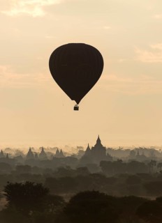 Hot-air Balloon in flight over temples of Bagan