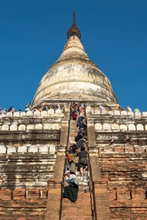 Visitors climb steep steps of Shwesandaw Pagoda