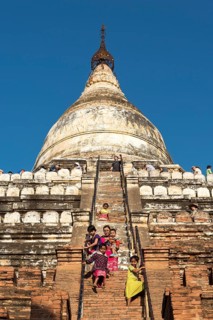 Visitors climb steep steps of Shwesandaw Pagoda