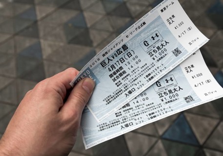 Fan holds tickets to a baseball game at Tokyo Dome
