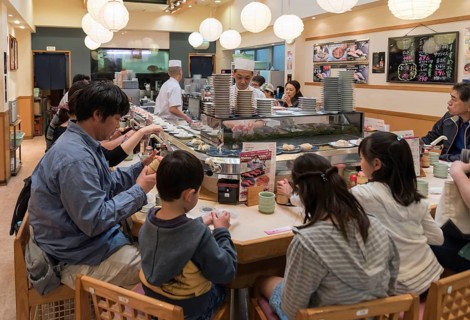 Kaiten-zushi restaurant serving sushi on rotating conveyor belt