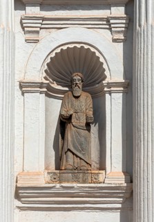 Apostle statue in a niche of the facade of St. Cajetan Church