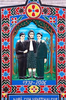 Tombstone of a mother showing her with her sons