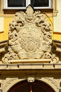 Baroque coat of arms over monastery gate