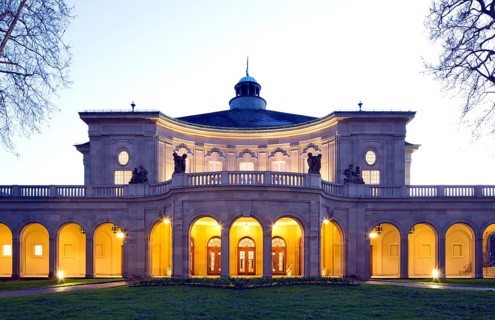 Illuminated Kursaal building or Regentenbau at dusk