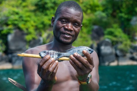 Local man holding fresh fishes
