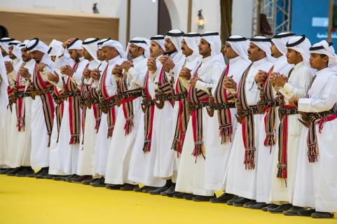 Traditional dressed local men dancing at the Al Janadriyah Festival