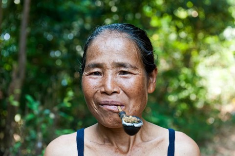 Woman with pipe in mouth