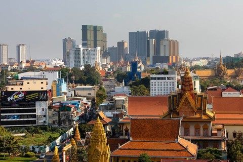 Panoramic view with Wat Ounalom and skyline from Koh Pich
