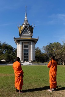 Buddhist monks in front of the Memorial Stupa