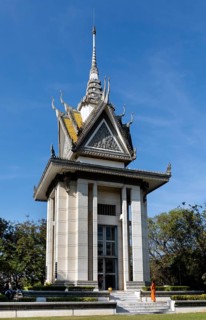 Buddhist monk in front of the Memorial Stupa