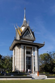 Buddhist monk in front of the Memorial Stupa