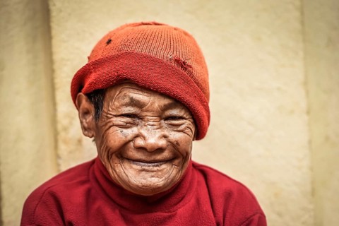 Laughing woman with cap