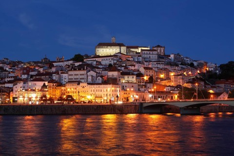 Historic centre with University and Mondego River at dusk