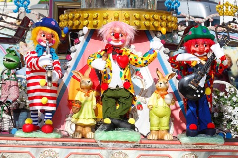 Clowns as decoration on a carousel