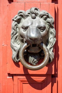 Old door knocker with lion figure