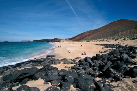 Playa de las Conchas and Volcano Montana Bermeja in the North