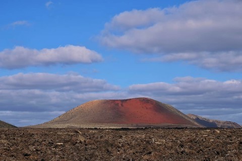Lavafield Caldera Colorada with red volcano Pico Partido