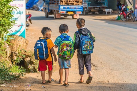 Three little boys going to school
