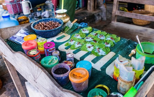 Market stall showing preparation of traditional chewing tobacco and betel nut