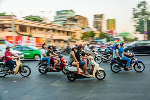 Scooter drivers in heavy traffic