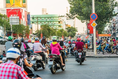 Scooter drivers in heavy traffic