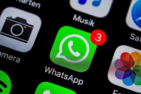 Smartphone screen with WhatsApp icon