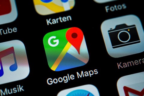 Smartphone screen displaying Google Maps and Camera apps in detail