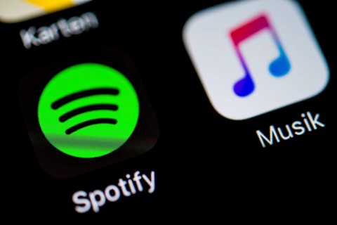 Smartphone screen with Music and Spotify app icons in detail
