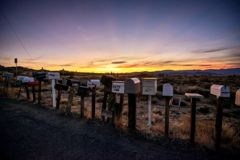 Roadside mailboxes at sunset
