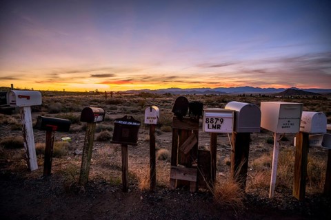 Roadside mailboxes at sunset