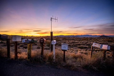 Roadside mailboxes at sunset