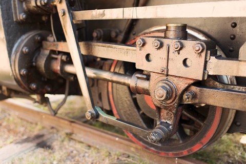 Close up of wheel on old steam train locomotive